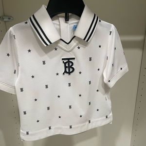 Burberry polo shirt for boys. Size is 2T and the color is white and black.